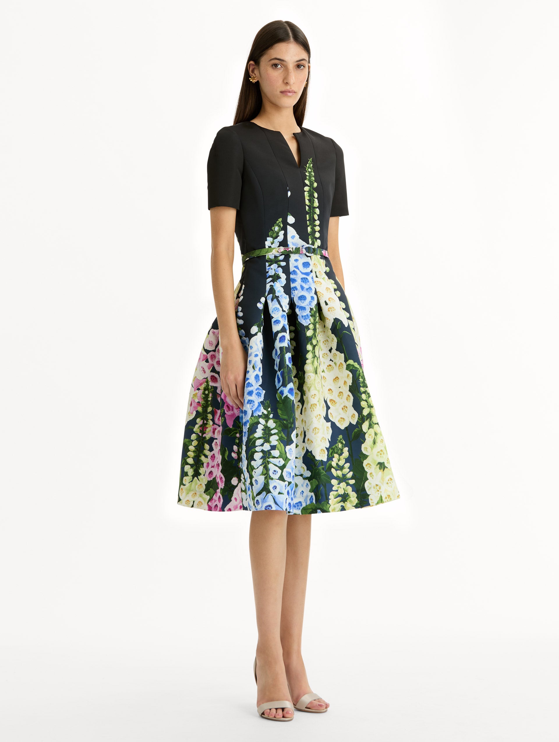 Black floral Degradé Foxglove Split-Neck Dress with belted waist and short sleeves. Side View.