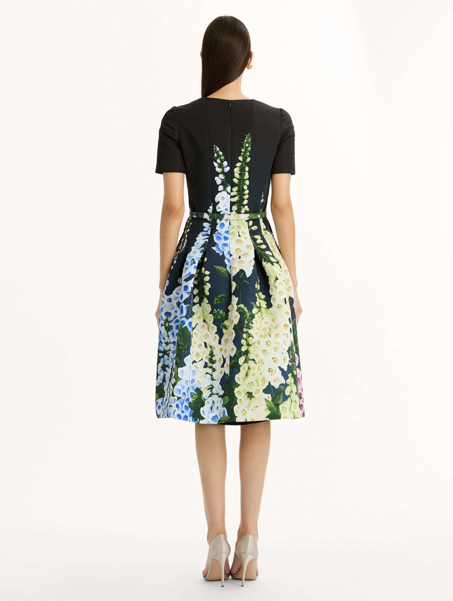 Black floral Degradé Foxglove Split-Neck Dress with belted waist and short sleeves. Back View.