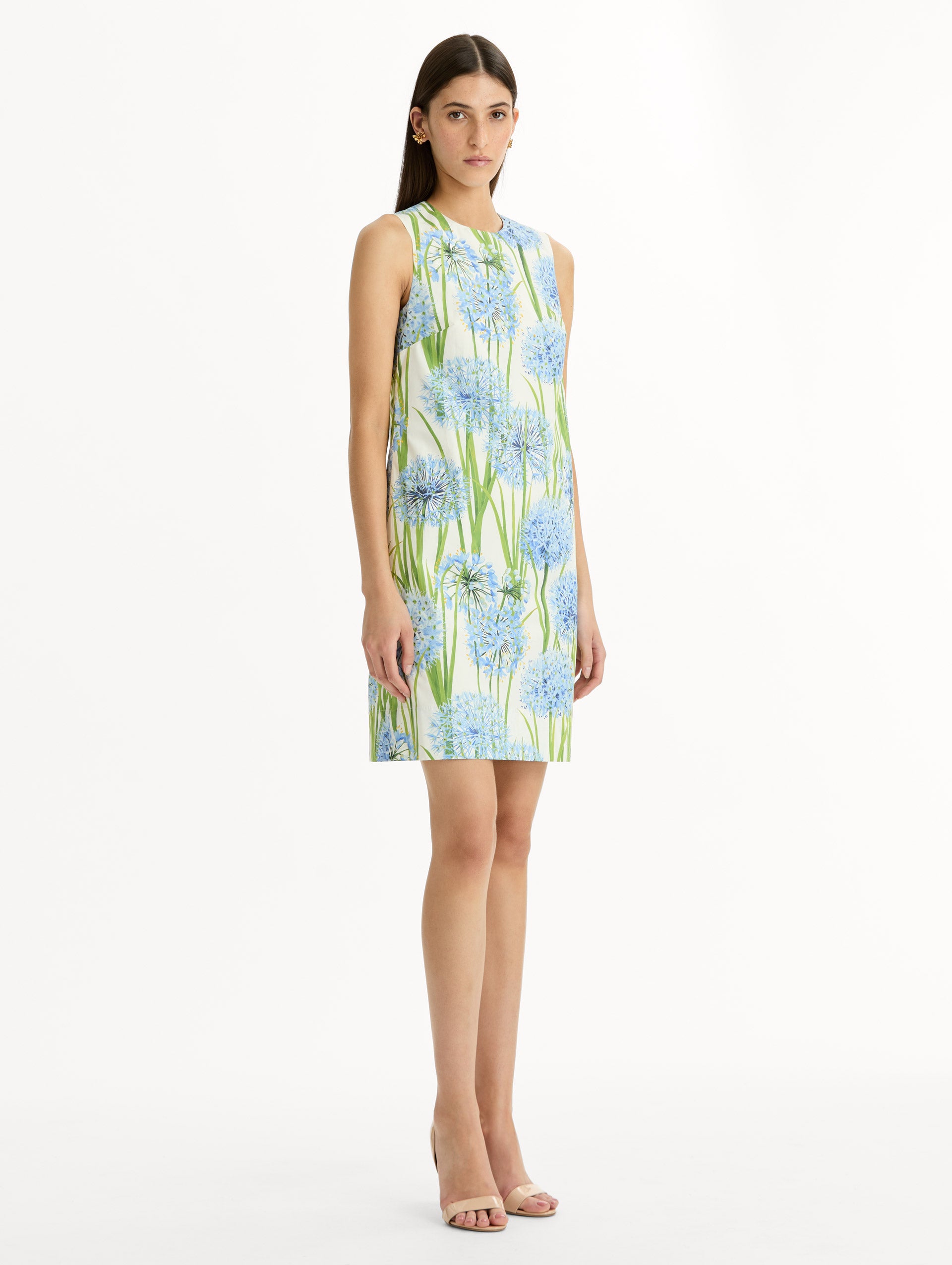 Ivory Allium Cotton Poplin Sleeveless Shift Dress with blue and green floral allium print. Side View.
