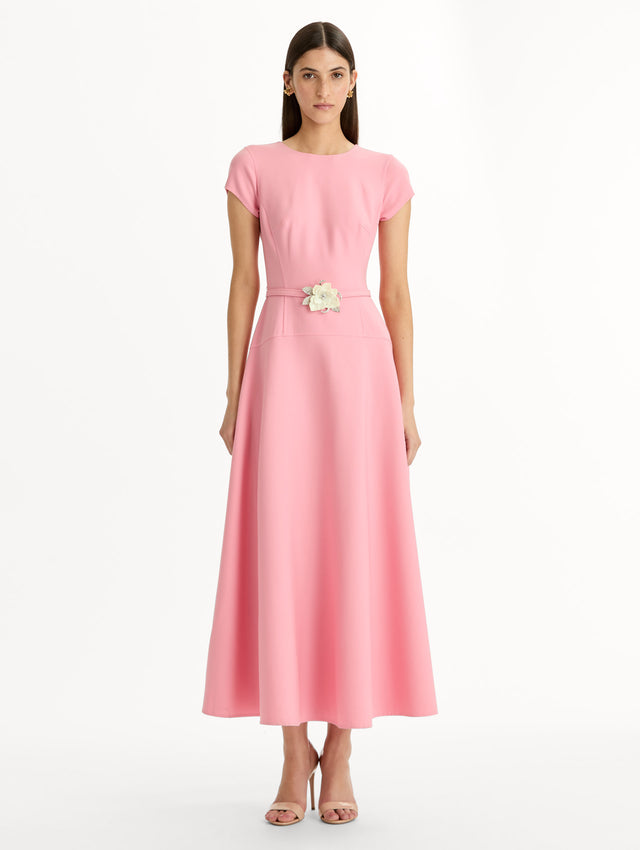 Pink Floral Belt Short Sleeve Dress with short sleeves and a belted waist featuring a white floral accent. Front View.