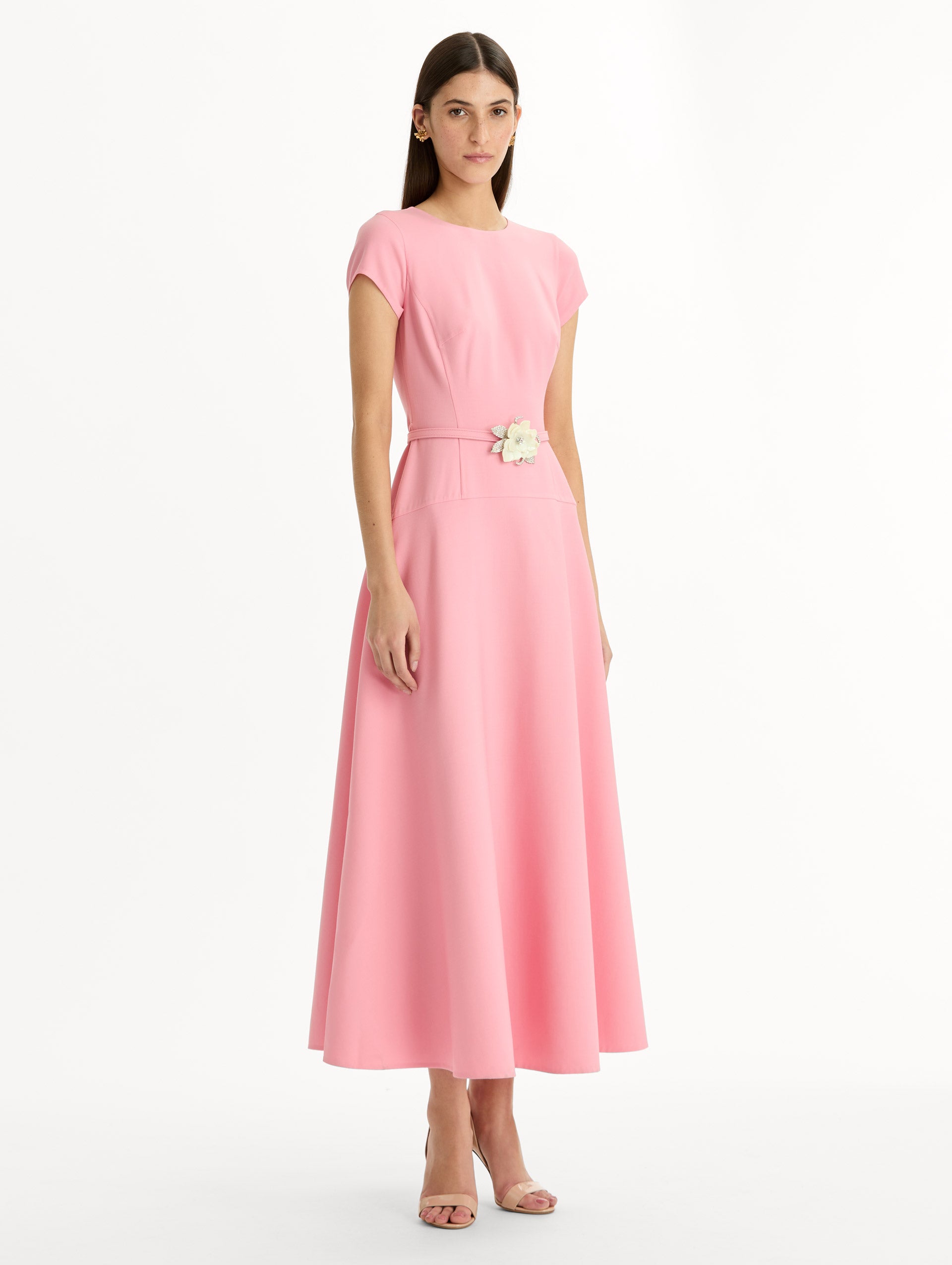 Pink Floral Belt Short Sleeve Dress with short sleeves and a belted waist featuring a white floral accent. Side View.