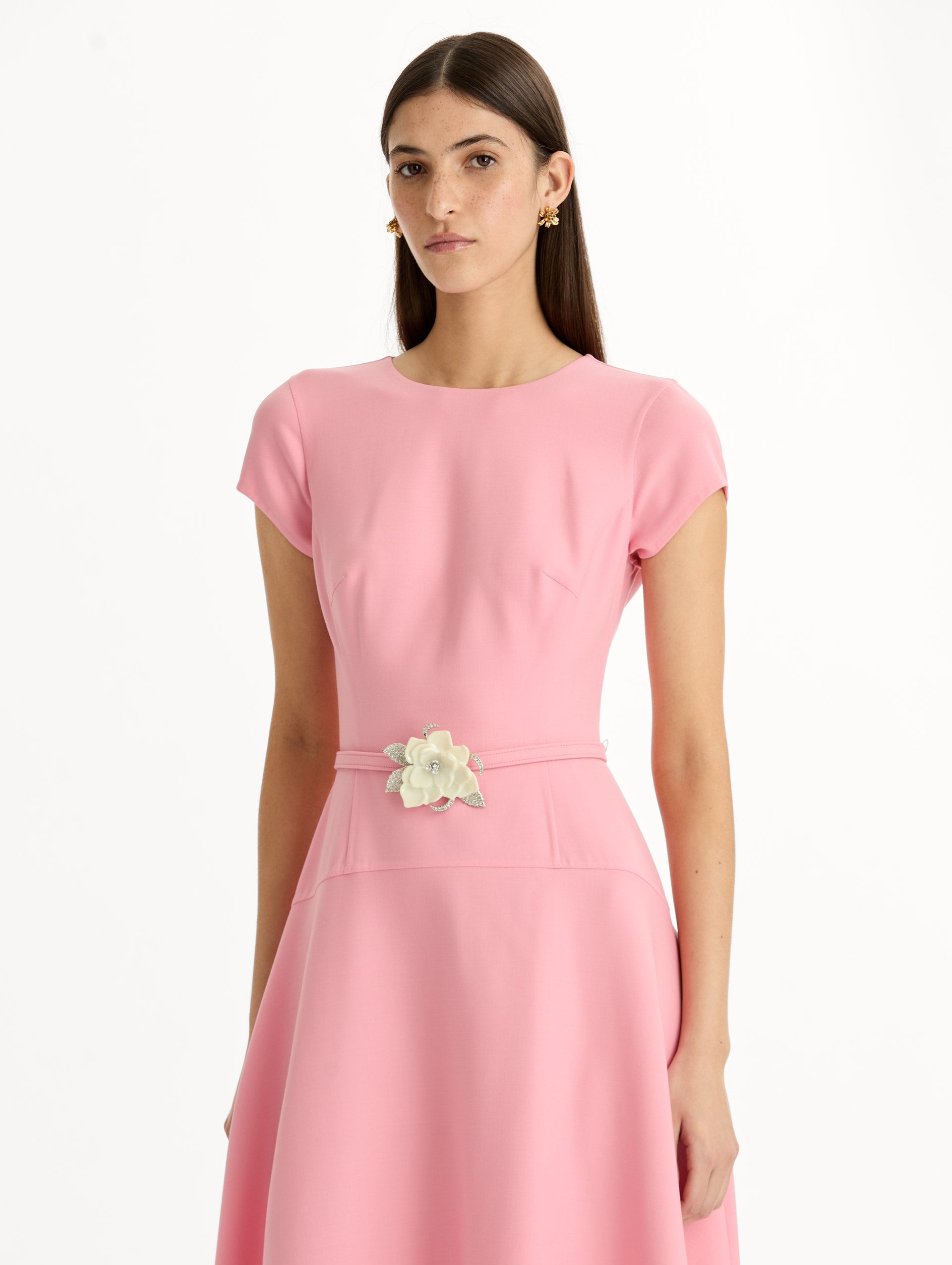 Pink Floral Belt Short Sleeve Dress with short sleeves and a belted waist featuring a white floral accent. Zoom View.