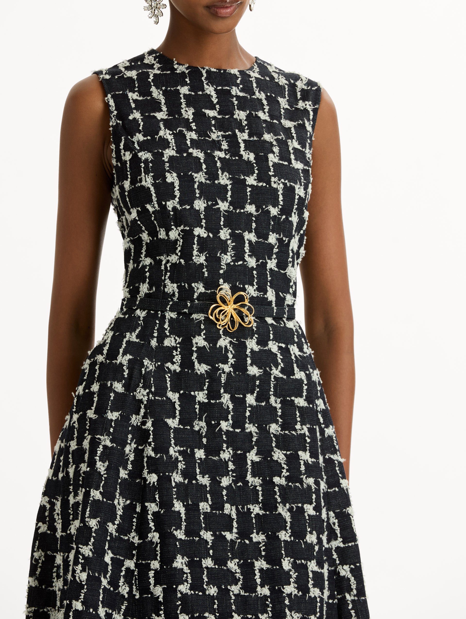 Black and Ivory Woven Denim Jacquard Midi Dress featuring a pleated skirt and belted waist with gold flower detail. Zoom View.