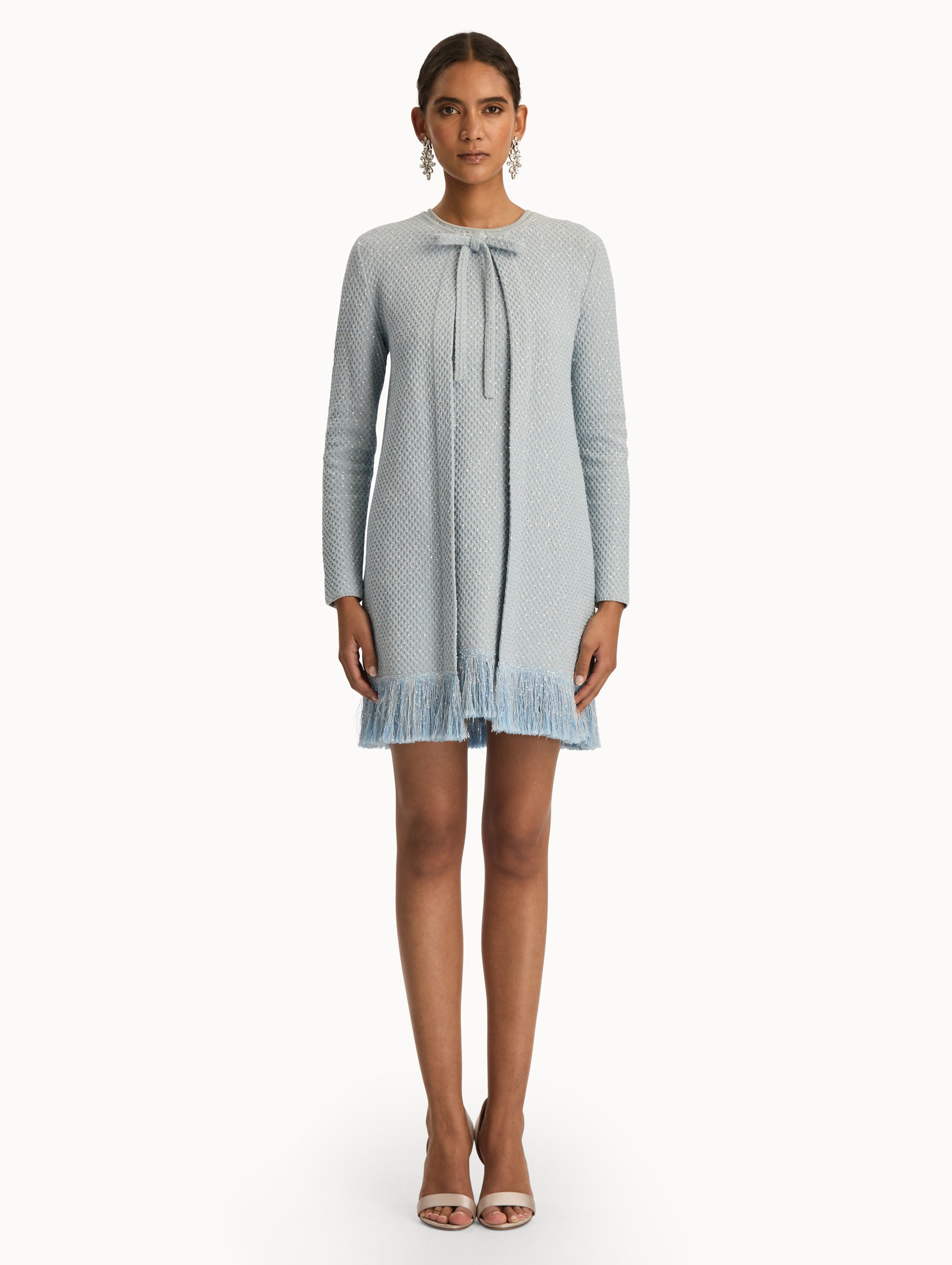 Blue quartz sequin tweed jacket with fringe trim. Front view.