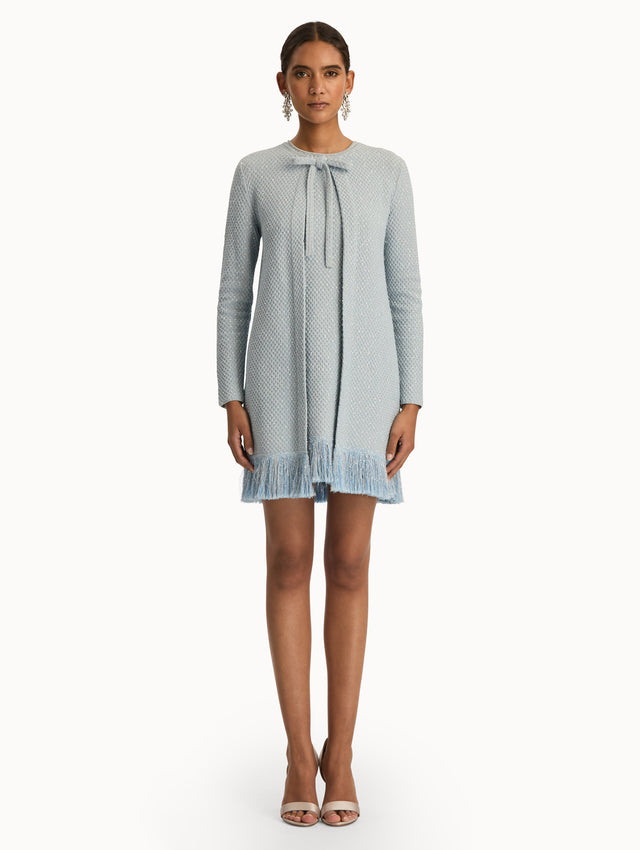 Blue quartz sequin tweed jacket with fringe trim. Front view.