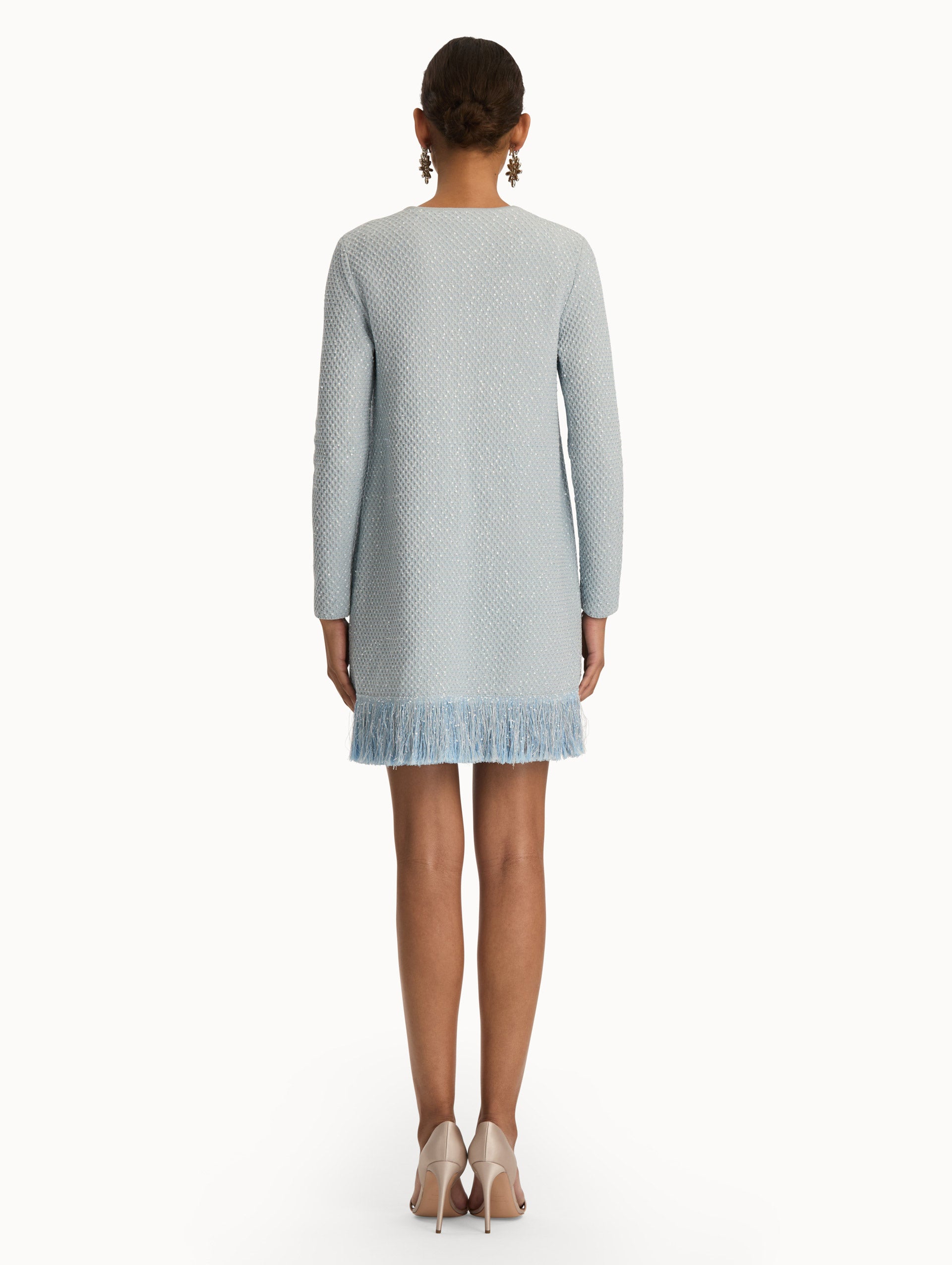 Blue quartz sequin tweed jacket with fringe trim. Back view.