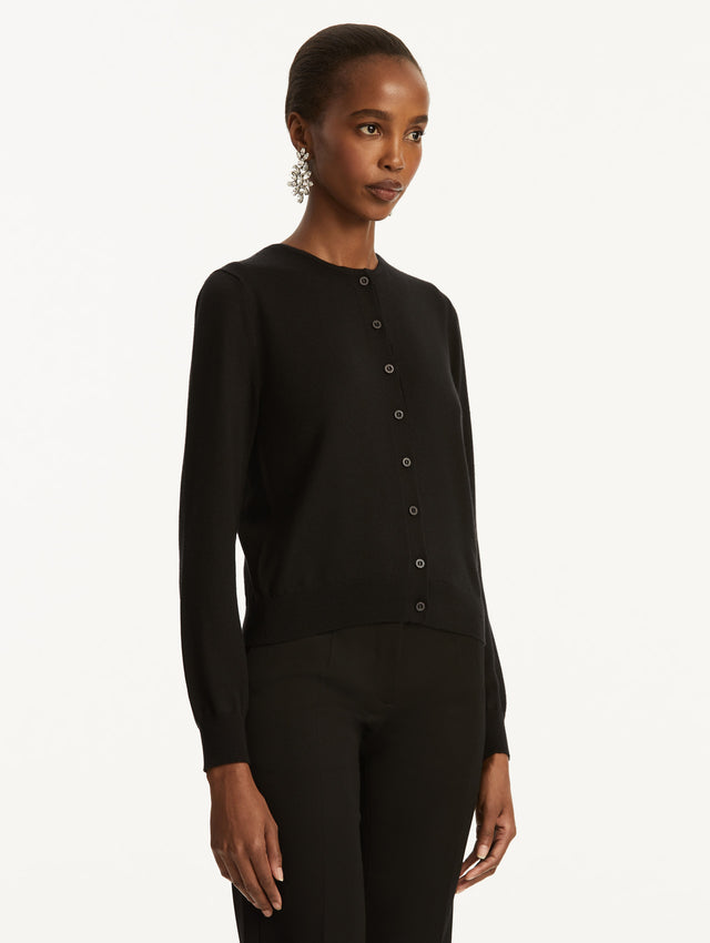 Wool-Blend Black Button-Down Cardigan Styled with Black Pants Side View