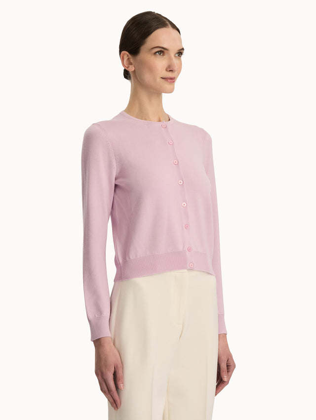 Front view of a pink wool cardigan.  Side View.