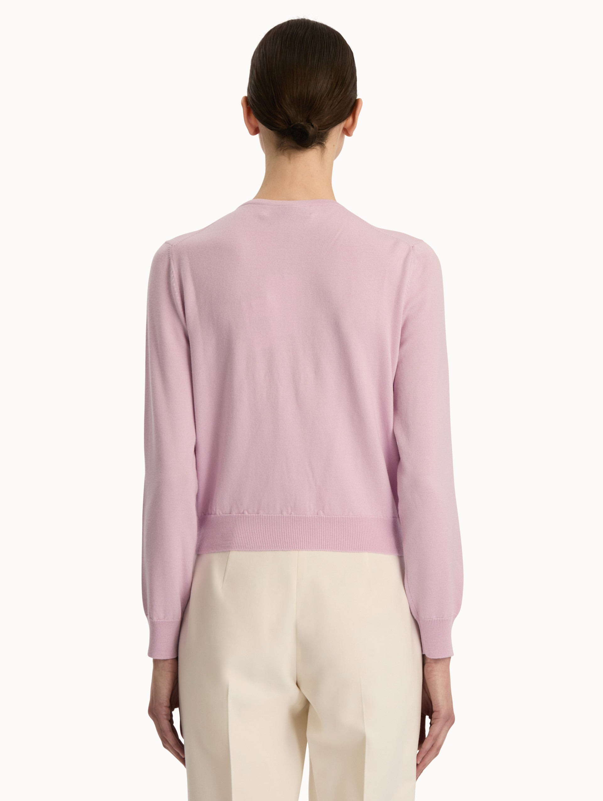 Front view of a pink wool cardigan.  Back View.