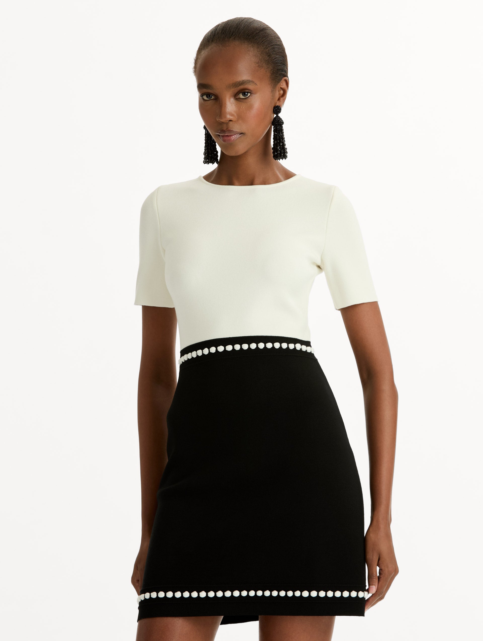 Black and White Bubble Trim Dress with a short sleeved white bodice and black skirt with white bubble trim. Zoom View.