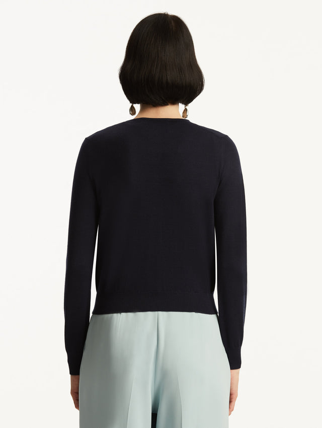 Wool-Blend Navy Cardigan Styled with Baby Blue Pants Back View
