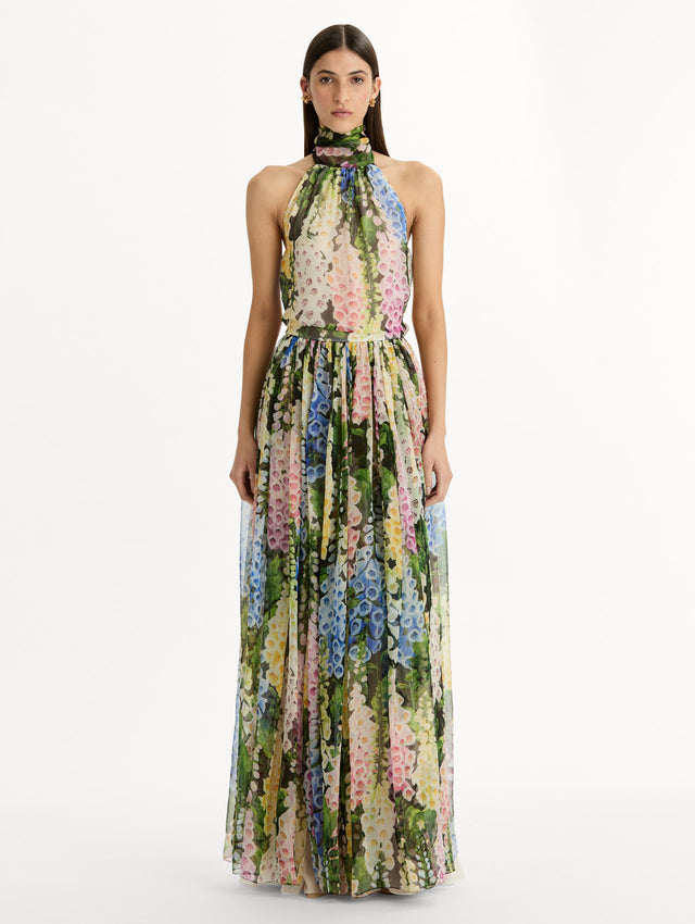 Floral Foxglove Chiffon Dress with high halter neck and pleated flowing chiffon skirt sinched at the waist. Front View.