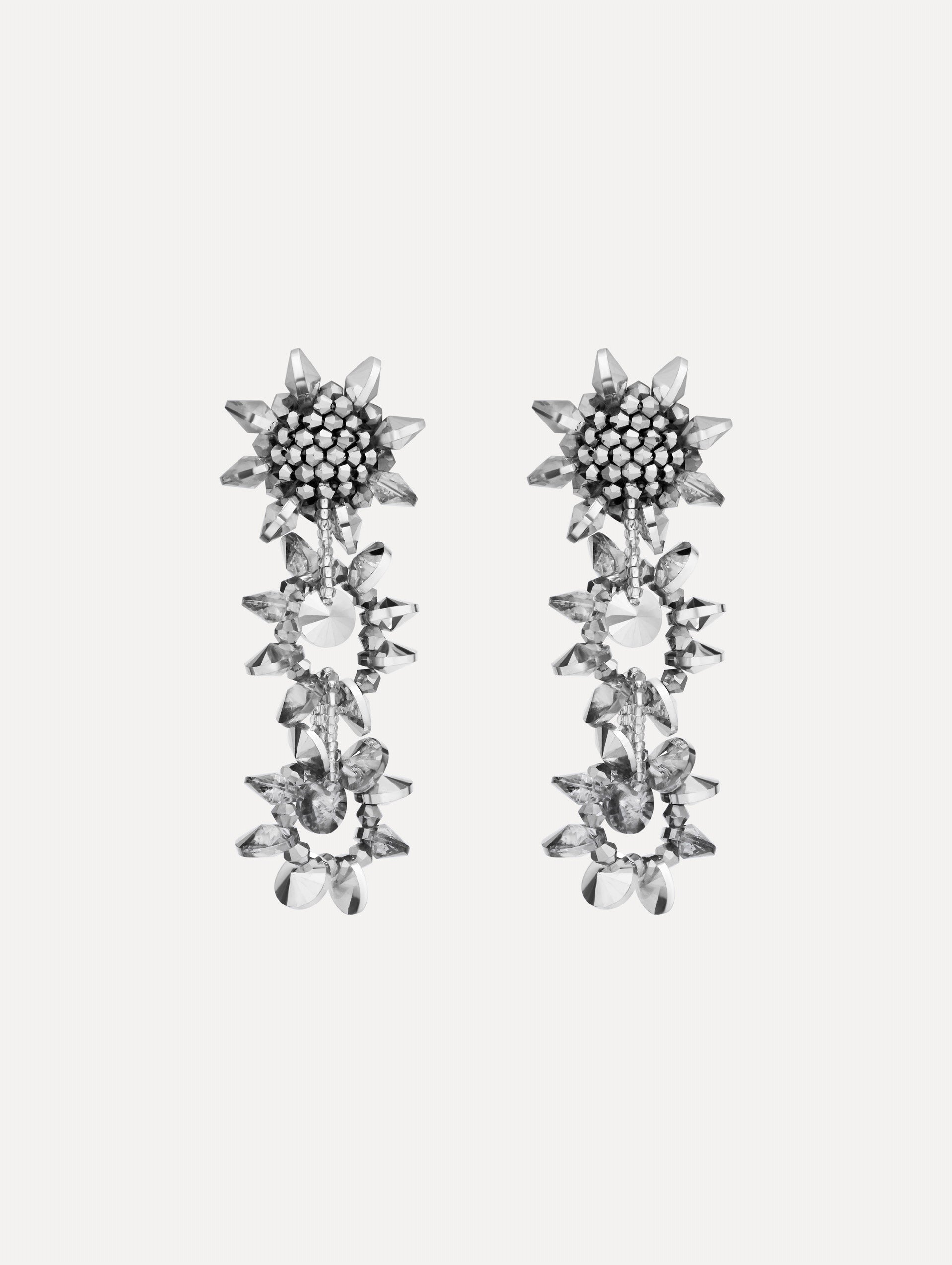 Silver Beaded Pompom Drop Earrings featuring clustered floral studs and cascading geometric crystal motifs.