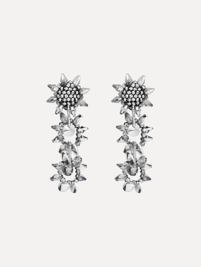 Silver Beaded Pompom Drop Earrings featuring clustered floral studs and cascading geometric crystal motifs.