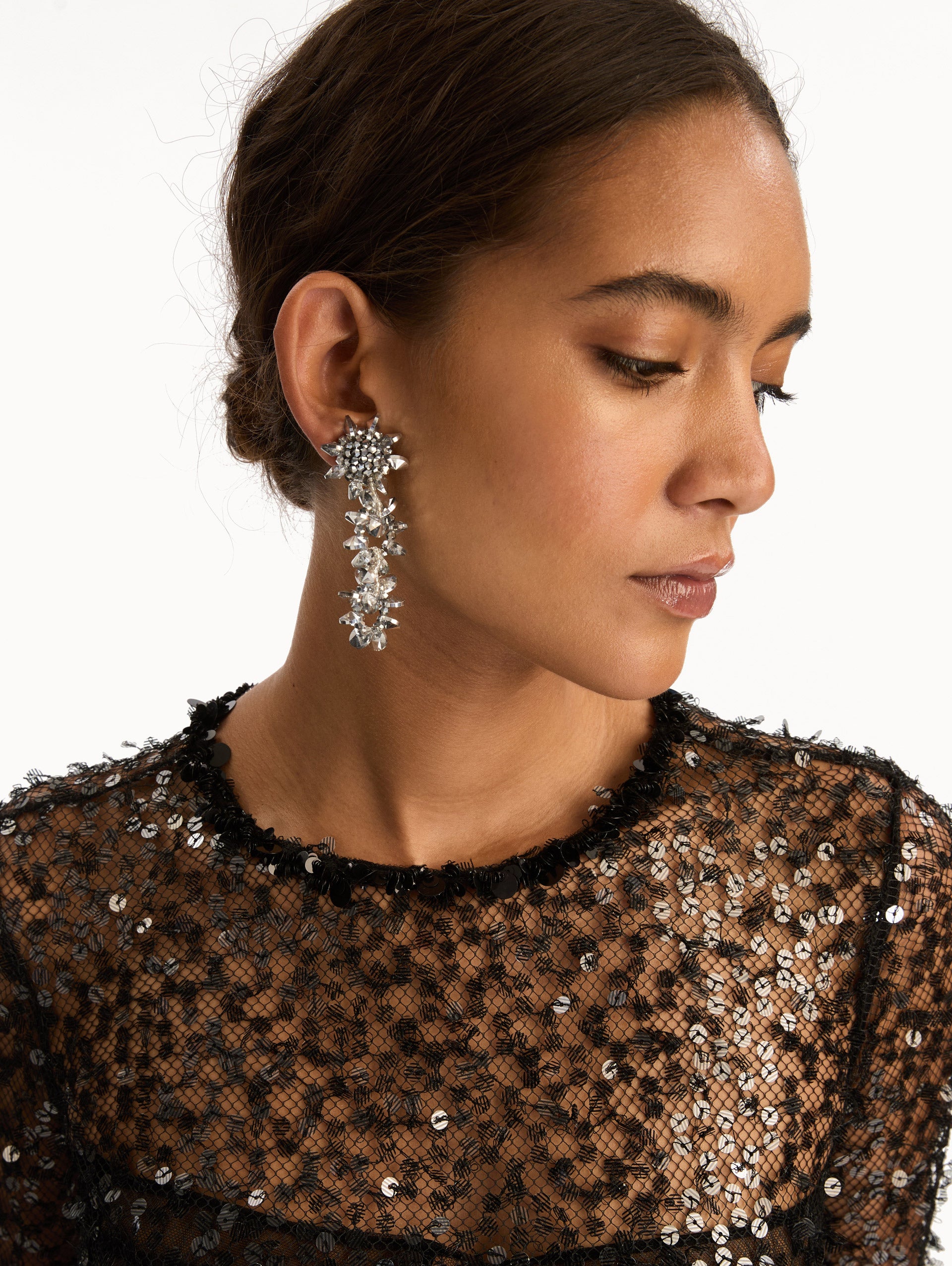 Silver Beaded Pompom Drop Earrings featuring clustered floral studs and cascading geometric crystal motifs. Side View.