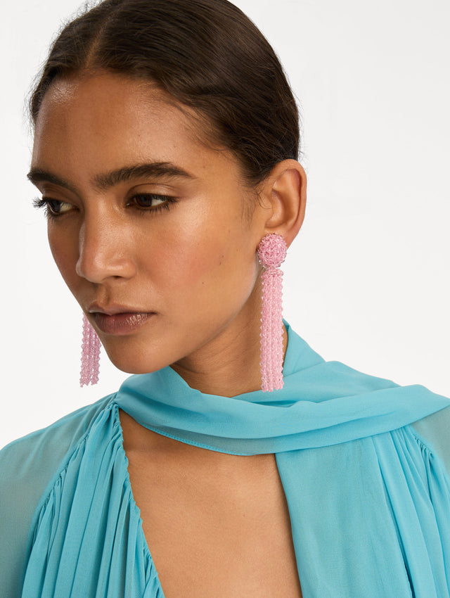 Pink Tassel Clip-On Earrings with clustered stud top and long strand drops. Side View.
