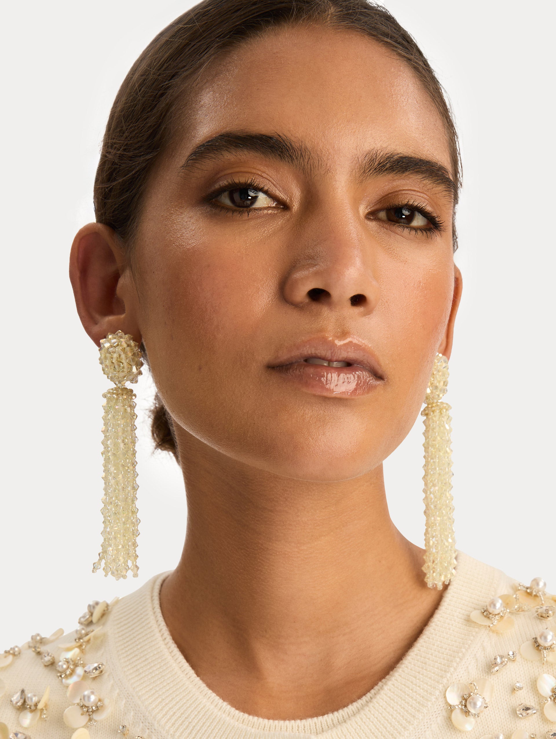 Ivory Tassel Clip-On Earrings with clustered stud top and long strand drops. Front View.