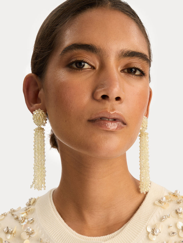 Ivory Tassel Clip-On Earrings with clustered stud top and long strand drops. Front View.