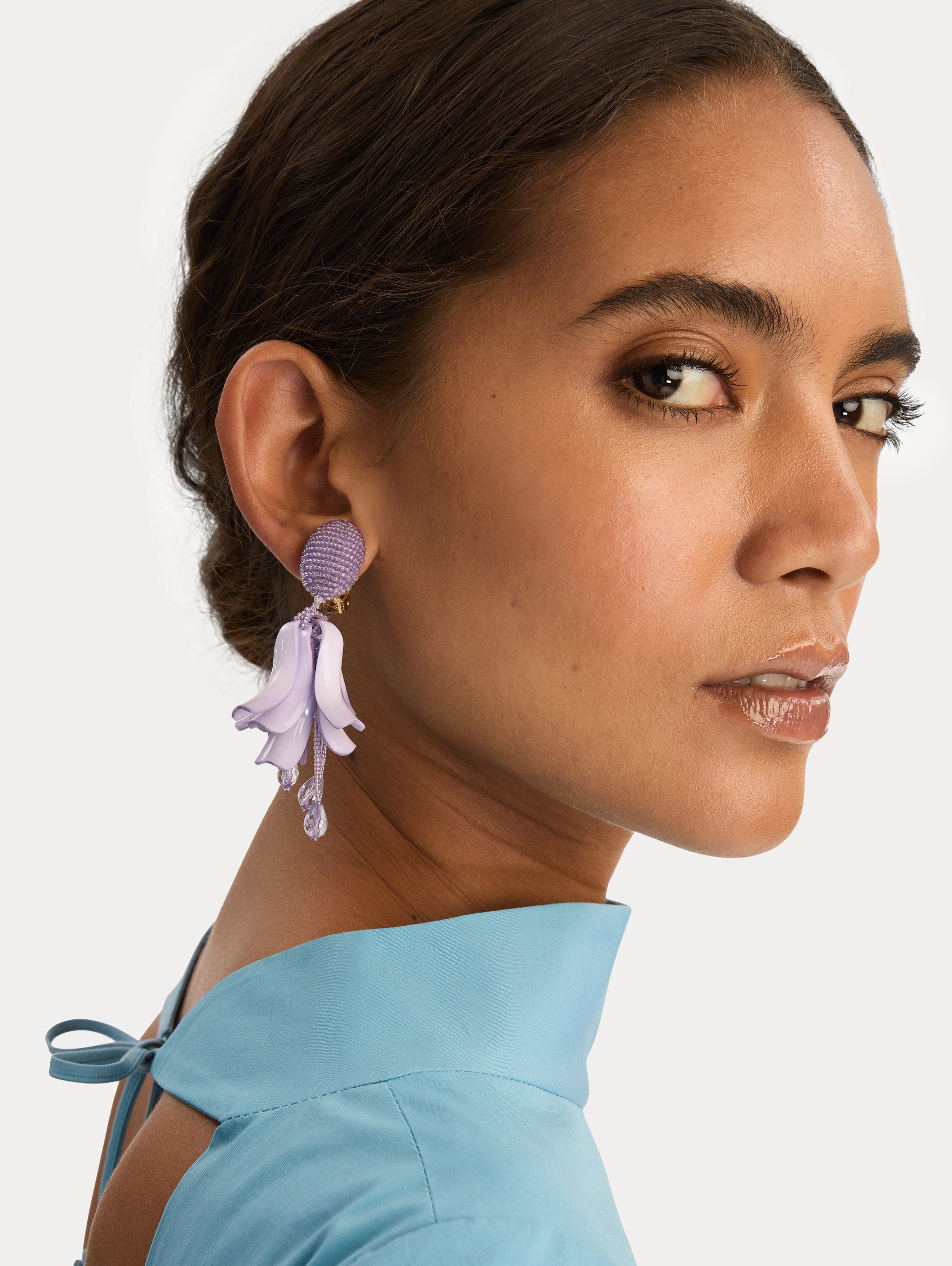 lilac Impatiens Clip-On Earrings with circular beaded studs and sculpted petal drops. Side View.