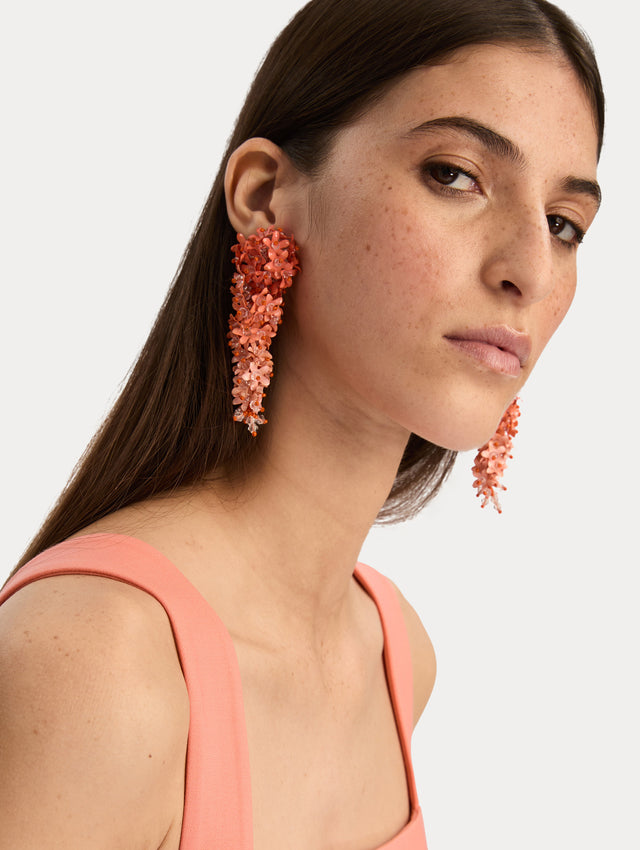 Coral Cascading Flower Clip-On Earrings with ombre layered petals. Front View.