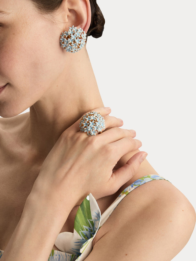 Gold Foxglove Pompom Ring with a clustered dome of light blue enamel flowers. Front View.