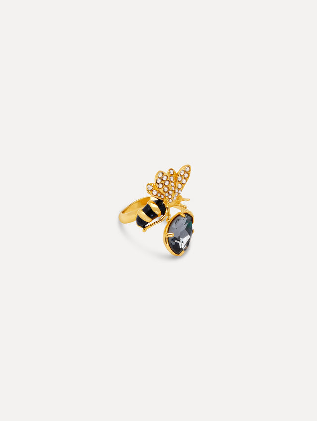 Gold Bee Crystal Ring with a crystal-embellished bee perched on a faceted black gemstone, featuring striped enamel details.