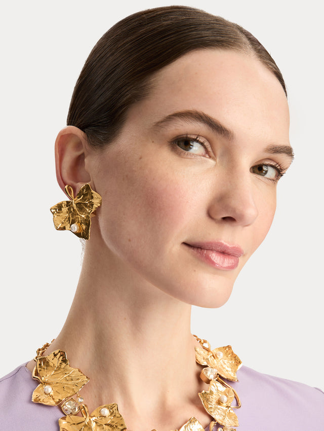 Gold Ivy Vine Necklace accented with pearls and faceted crystals on a mixed chain and vine-like structure. Side View.