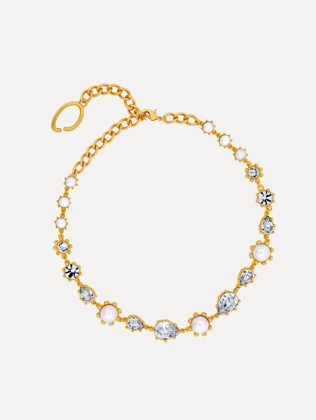 Gold Faceted Crystal Necklace featuring alternating white pearls and clear crystal settings in a graduated design.