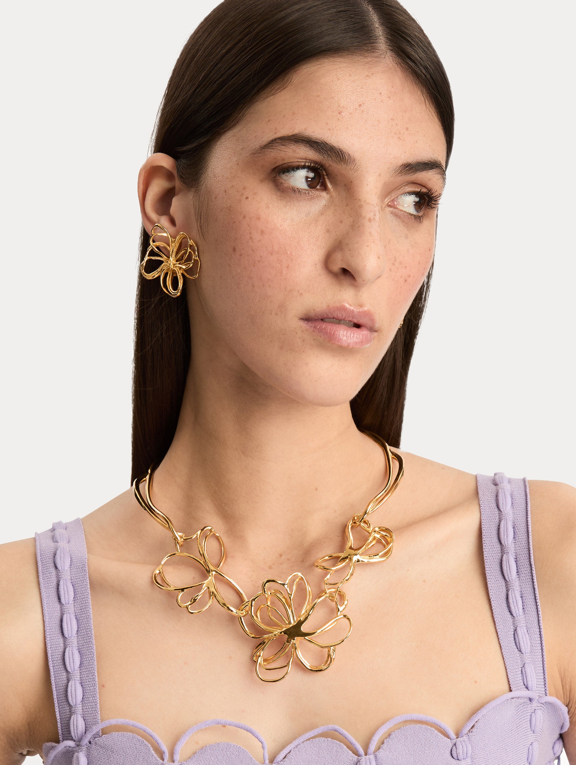 Gold Threaded Flower Necklace with three abstract flower designs at the center on a structured collar chain. Front View.