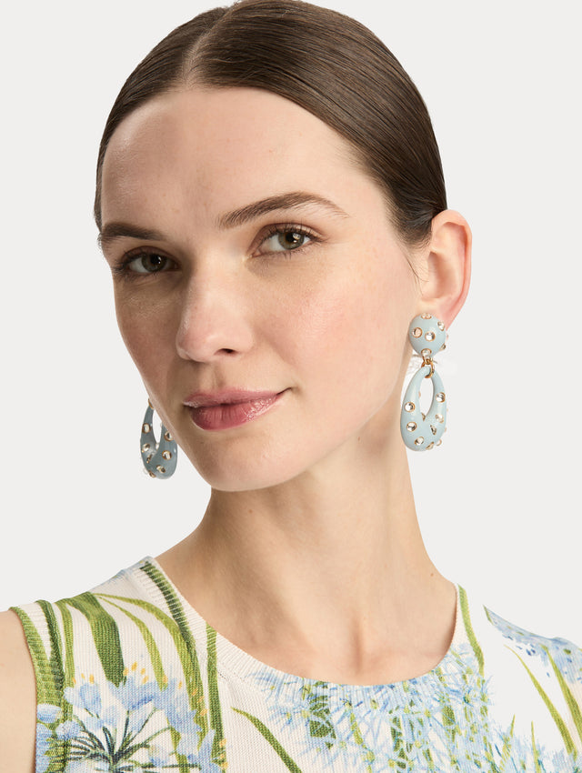 Light Blue Enamel Cabochon Hoop Clip-On Earrings with a domed stud and open hoop, both accented by gold-trimmed crystal inlays. Front View.