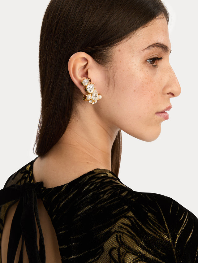 Gold Faceted Crystal Cuff Clip-On Earrings featuring teardrop crystals, round pearls, and pavé accents. Side View.