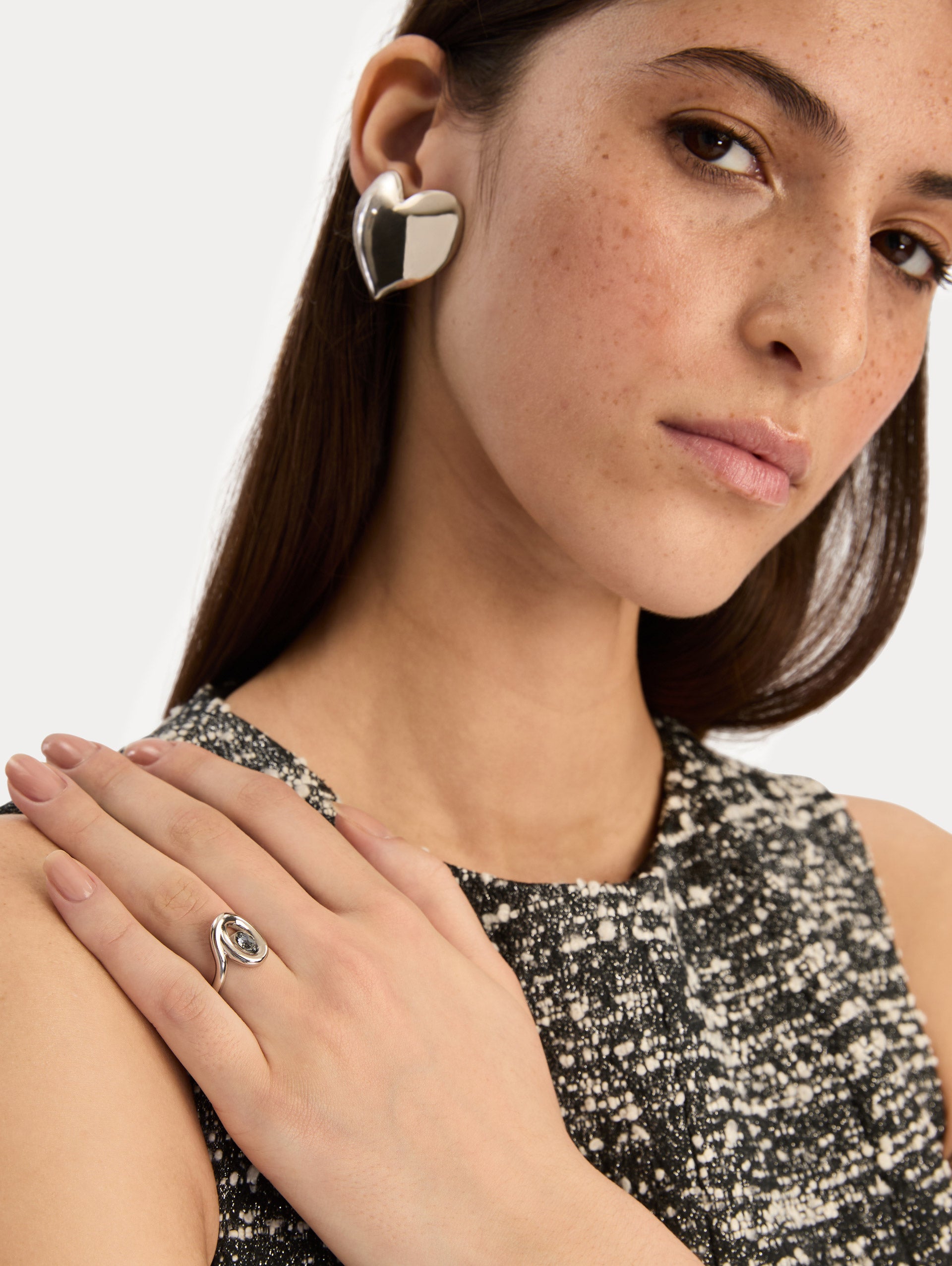 Silver Heart Clip-On Earrings with a smooth finish. Side View.