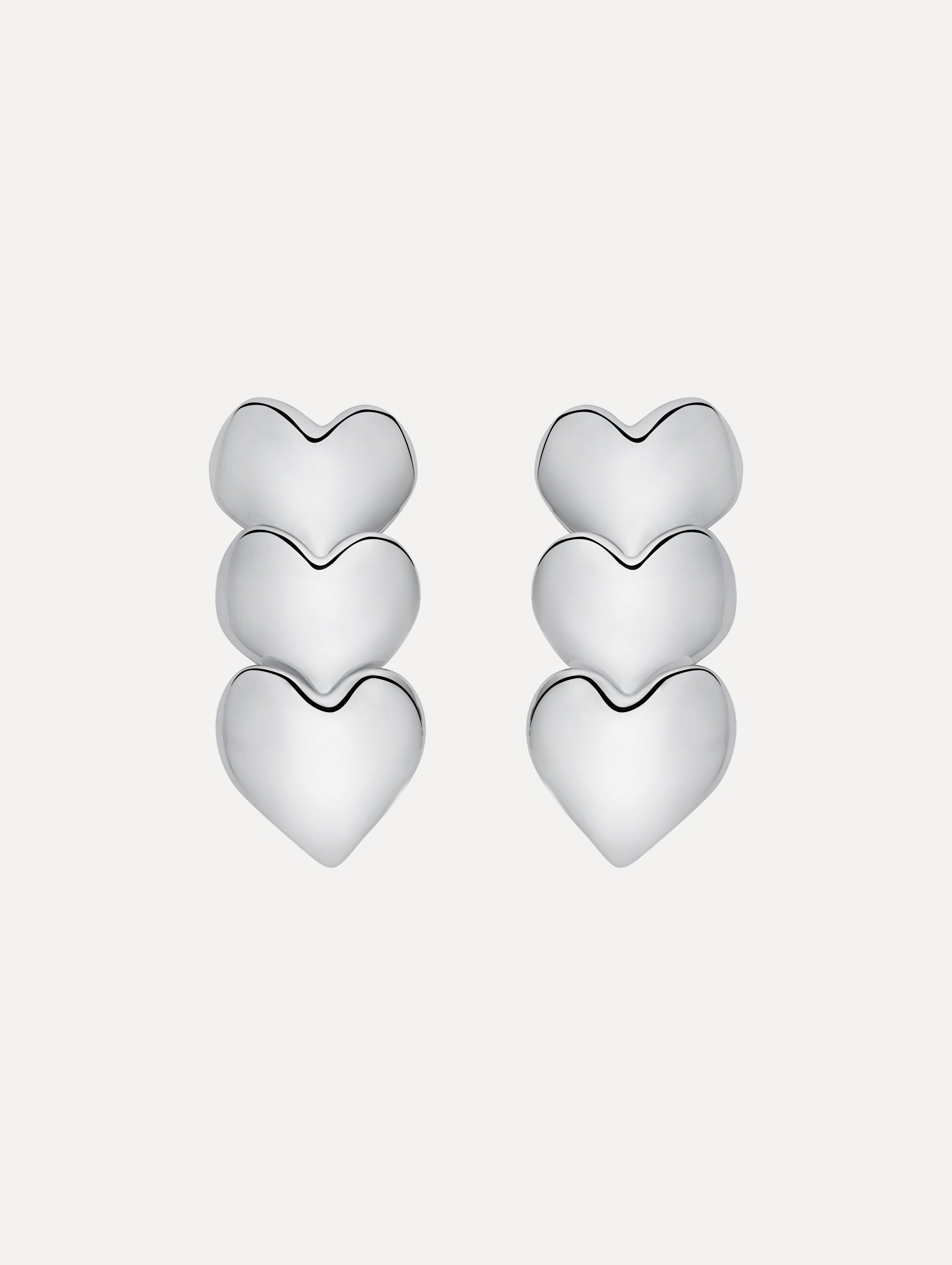 Silver Heart Drop Clip-On Earrings featuring a vertical stack of three hearts.