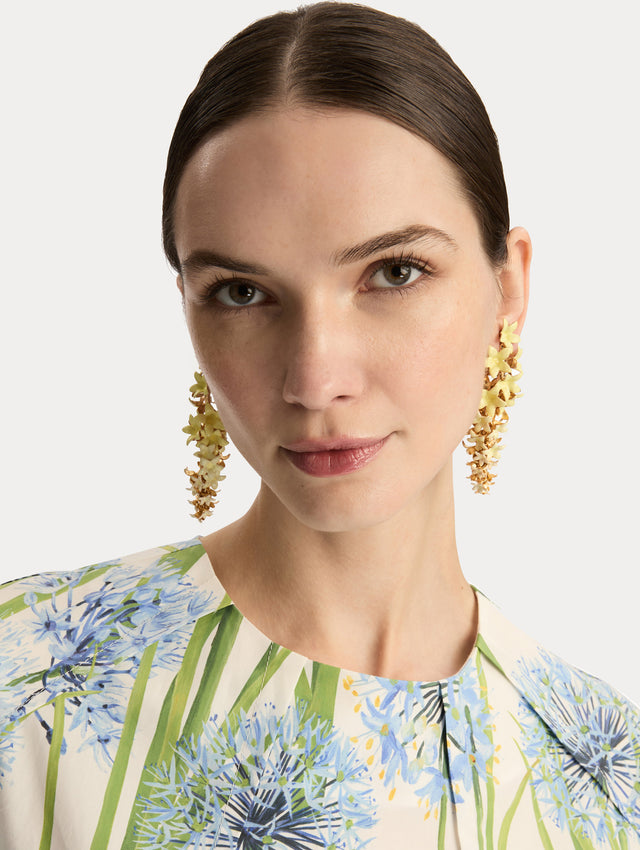Yellow Foxglove Earrings featuring layered enamel petals with gold accents. Front View.