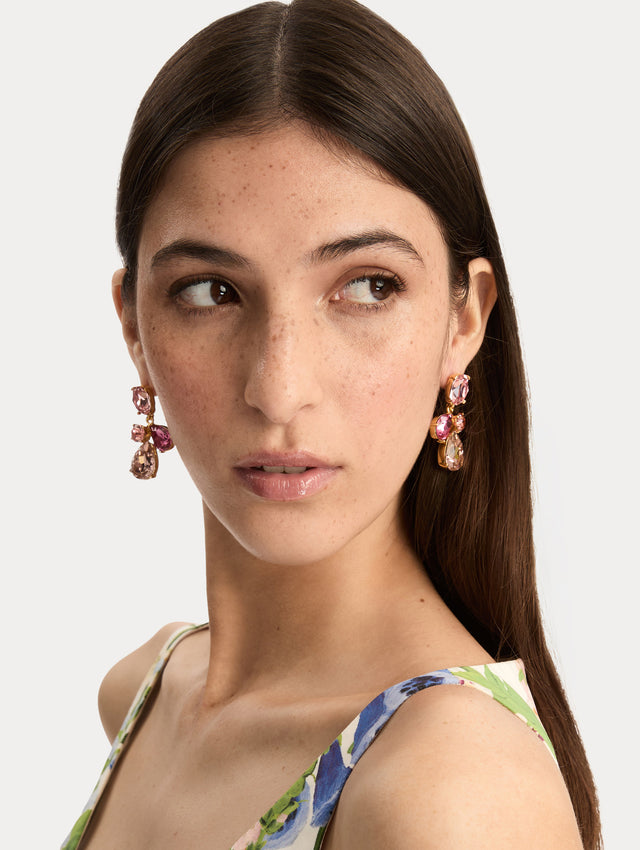 Gold Candy Drop Earrings featuring pink oval studs, round crystals, and faceted teardrop pendants in blush and fuchsia tones. Front View.