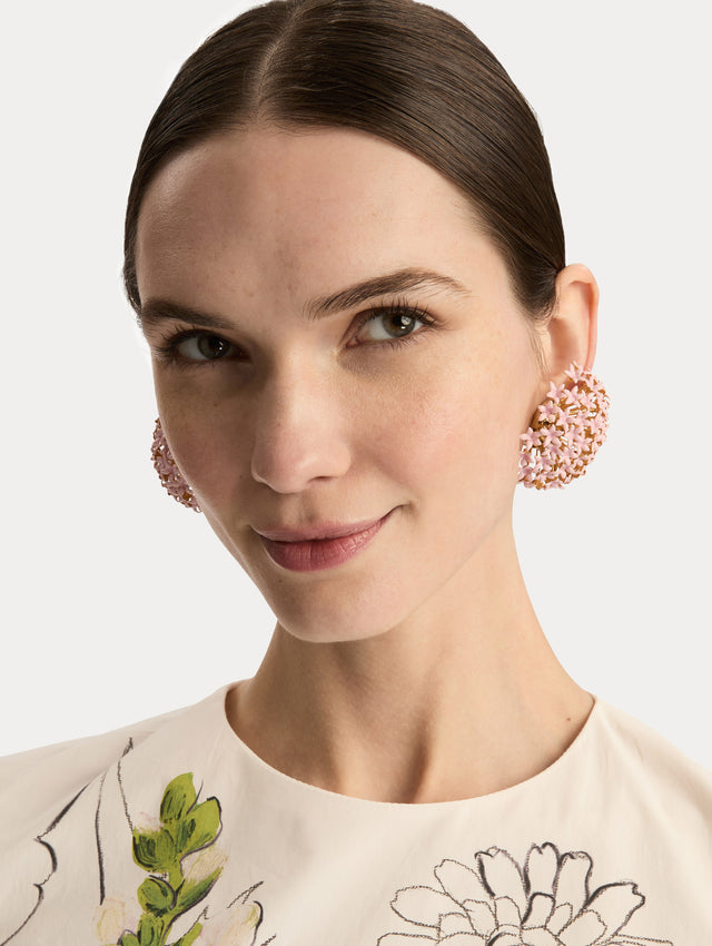 Pink Large Foxglove Pompom Clip-On Earrings featuring gold settings with enamel blossoms. Front View.