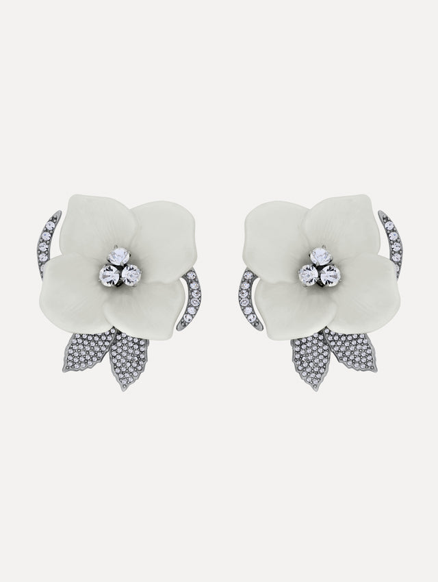White and silver Pearl Blossom Clip-On Earrings featuring enamel petals, crystal centers, and pavé leaf accents.