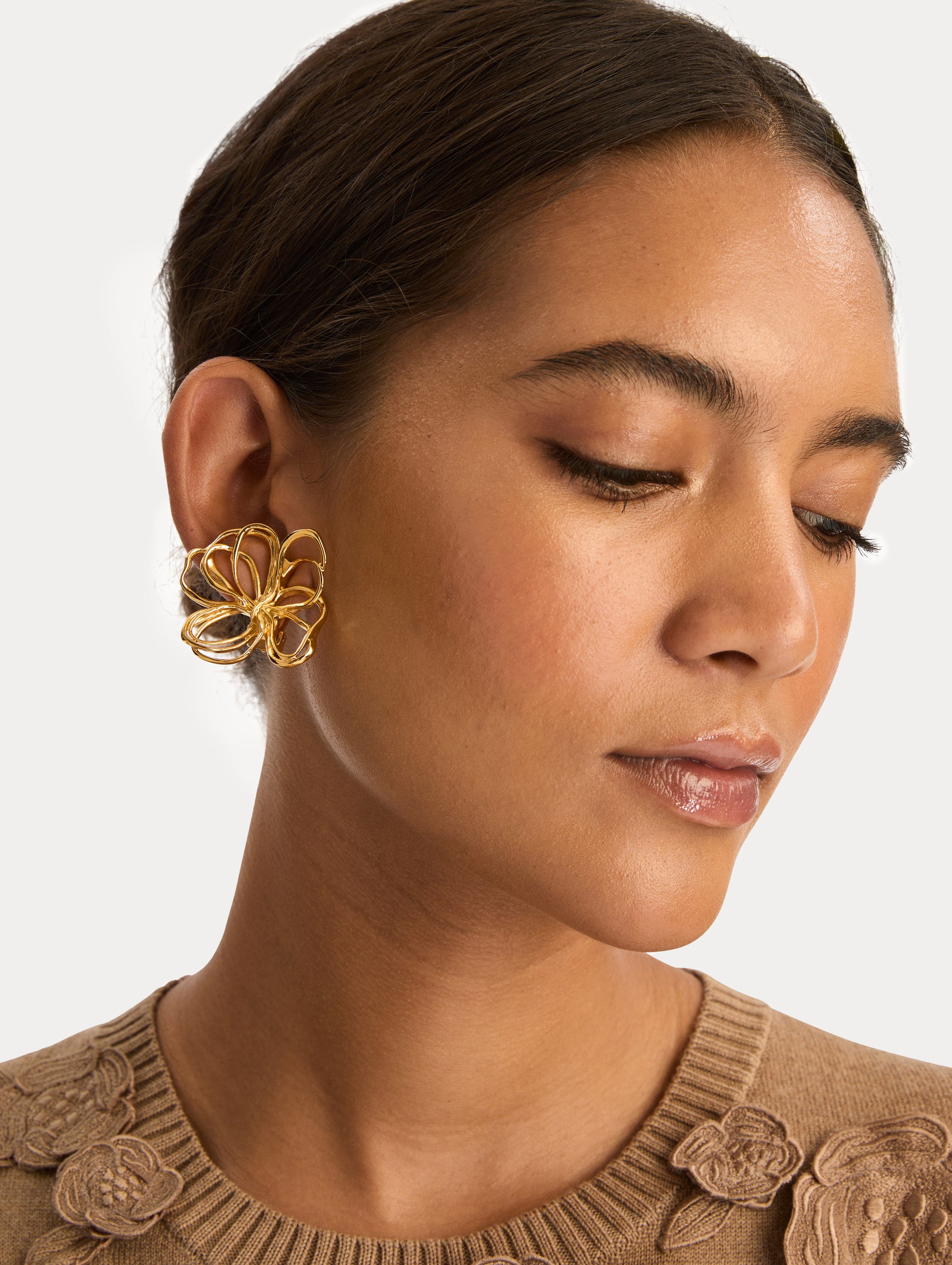 Gold Threaded Flower Earrings with abstract wiring. Side View.