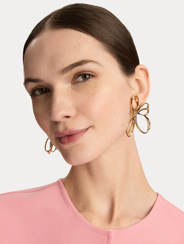 Gold Threaded Flower Asymmetrical Clip-On Earrings featuring openwork looping design. Front View.