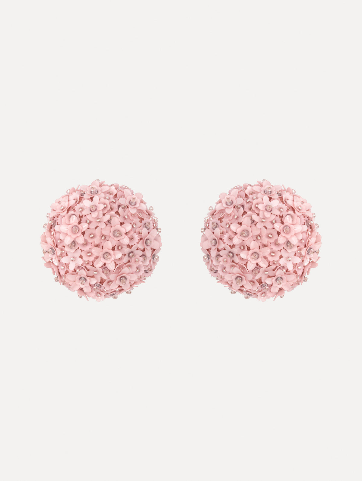 The image depicts flower pompom large earrings. Front view.