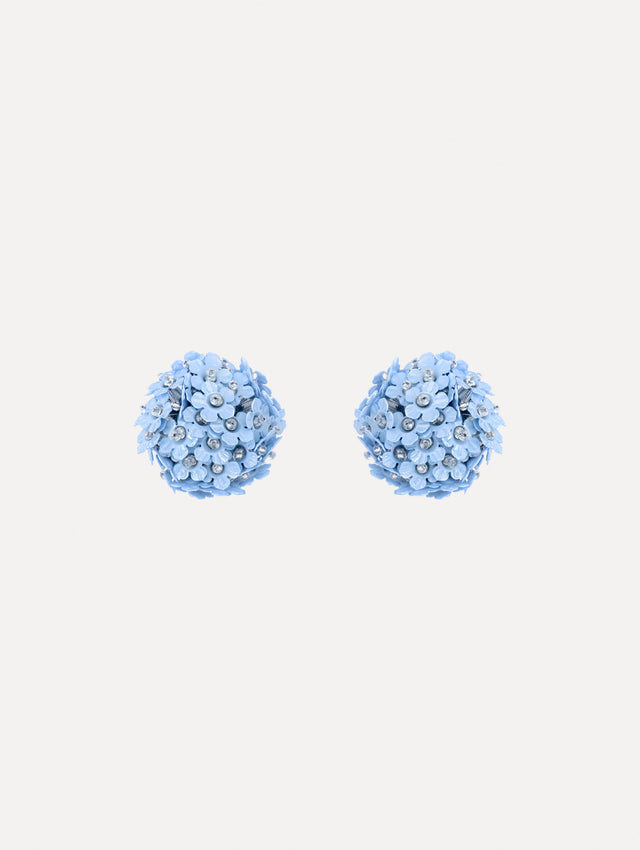 The image depicts flower pompom small earrings. Front view.