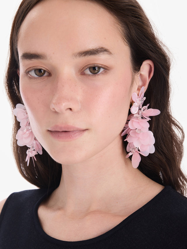 The model is wearing sequin cascade earrings. Front view.