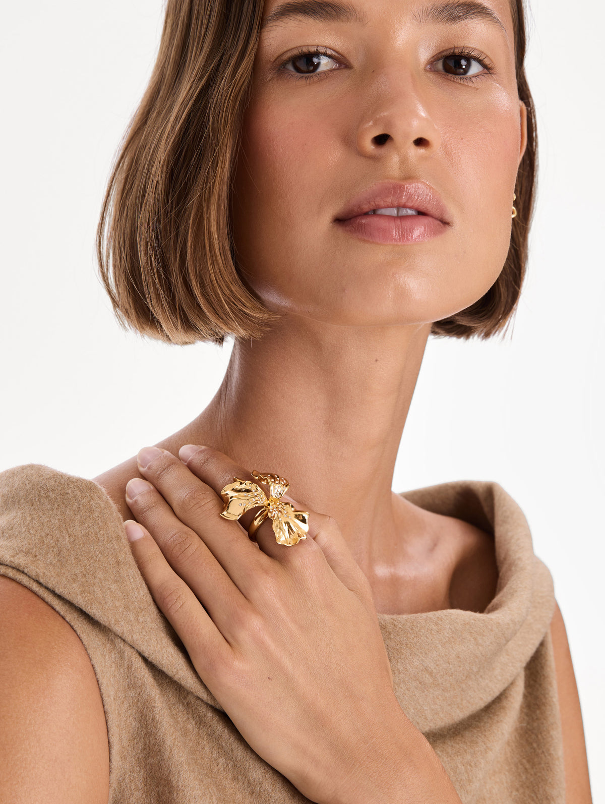 The model is wearing an iris flower ring. Front view.