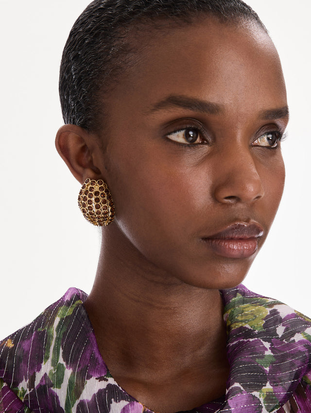 The model is wearing crystal domed earrings. Front view.