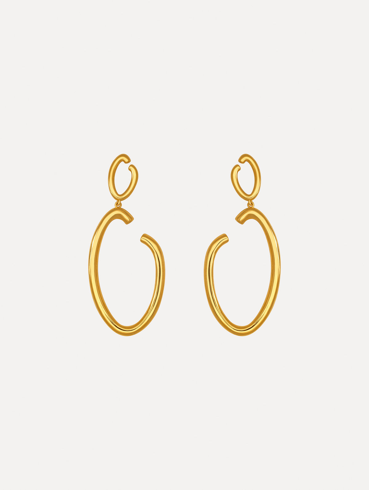 The image depicts large O logo earrings. Front view.