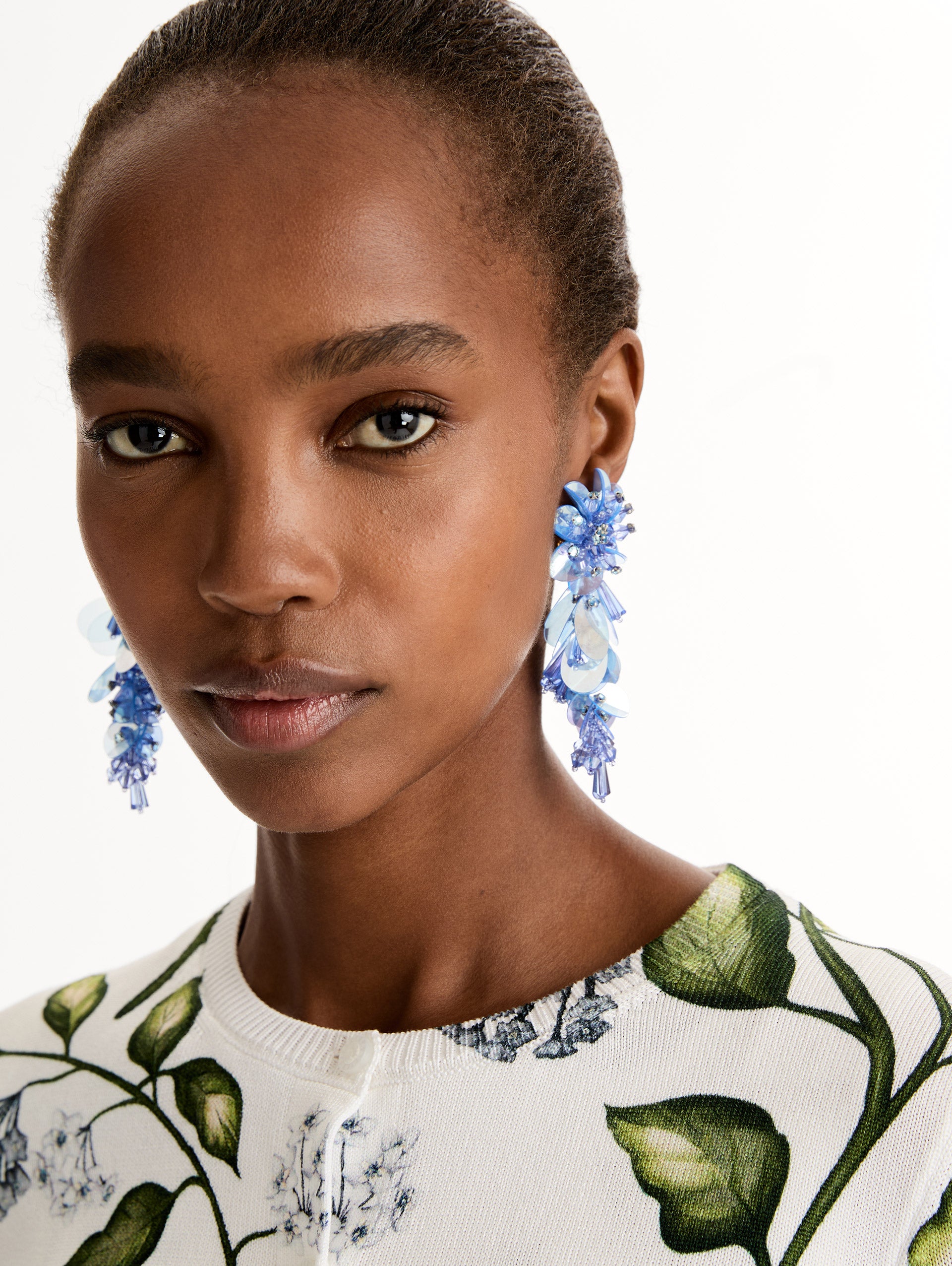 Blue Bouquet Drop Clip-On Earrings with blue cascading irredescent beaded flowers. Front View.