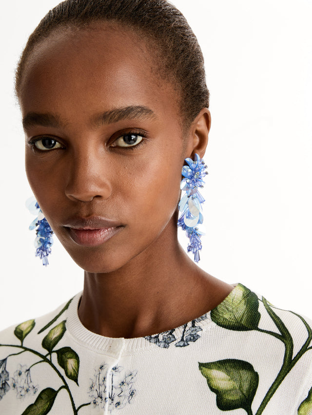 Blue Bouquet Drop Clip-On Earrings with blue cascading irredescent beaded flowers. Front View.