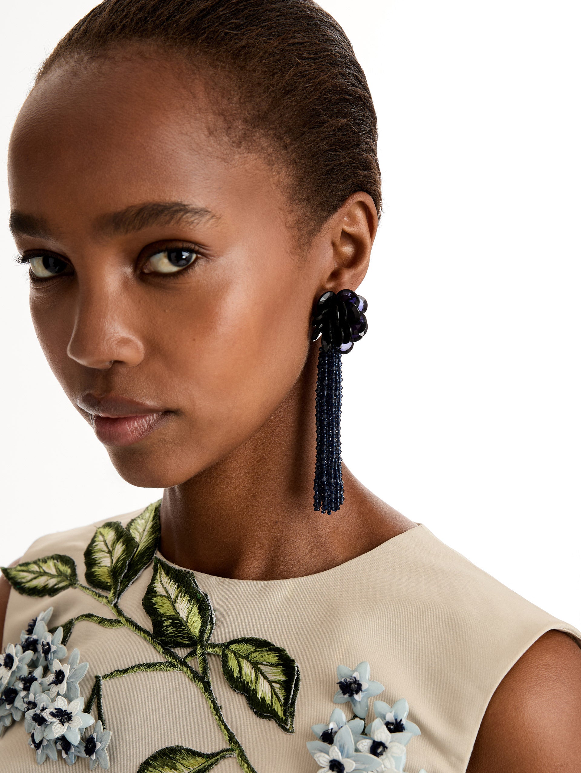Navy Flower Chandelier Clip-On Earrings with flower stud and beaded cascading tassel. Front View.