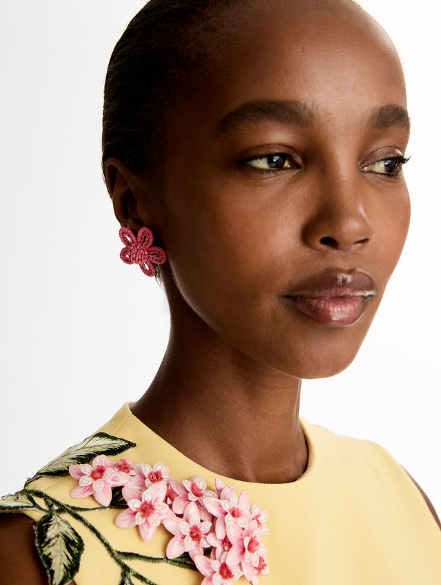 Pink Small Woven Raffia Flower Earrings with pink raffia in a flower shape. Front View.