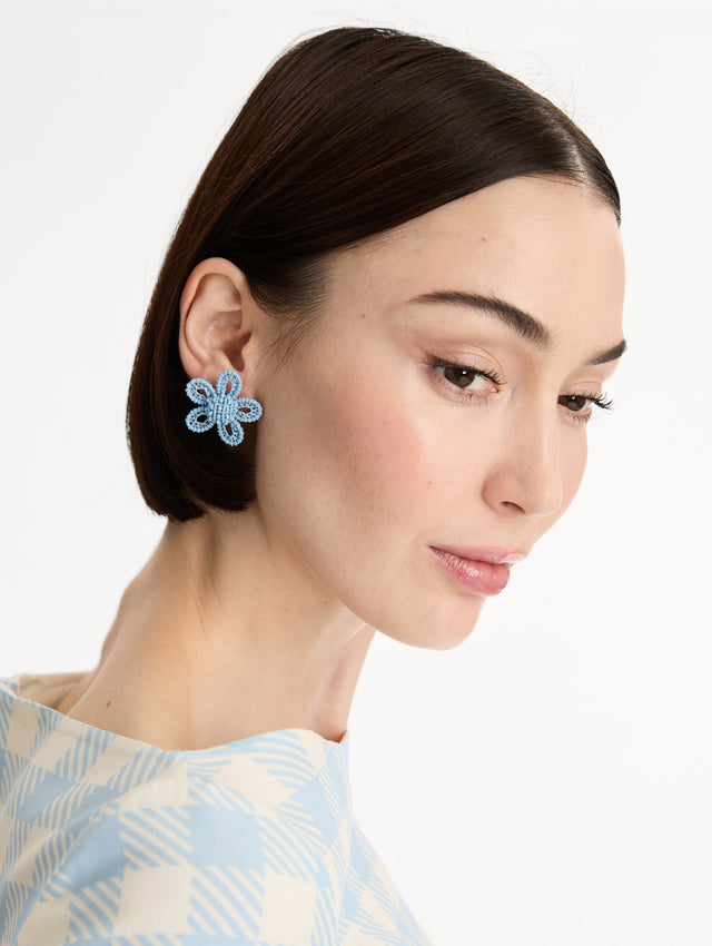 Blue Small Woven Raffia Flower Earrings with blue raffia in a flower shape. Front View. 